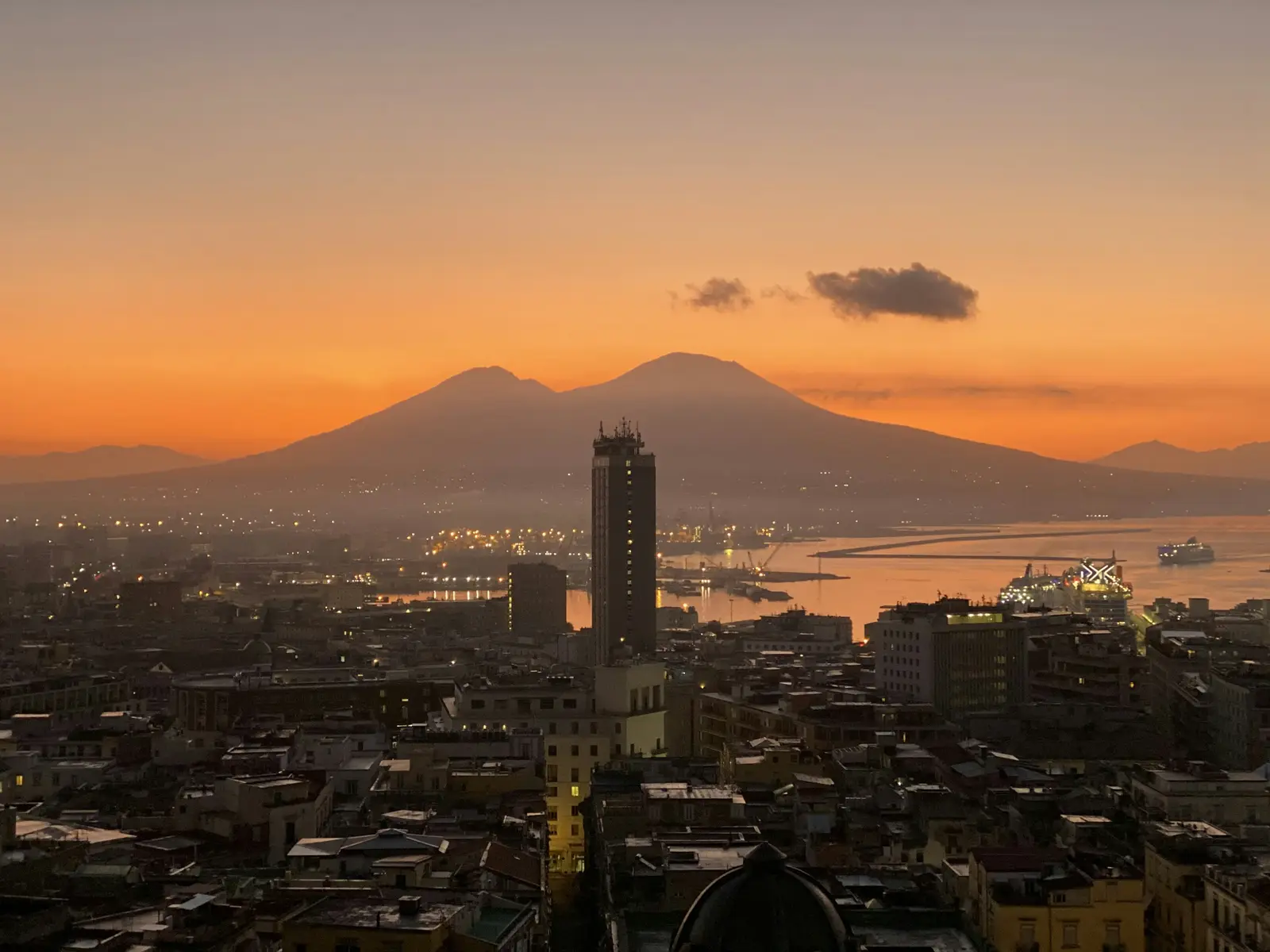 Naples skyline at sunrise with Mount Vesuvius above the Bay of Naples